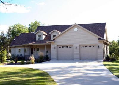 Exterior of house with multiple garage doors