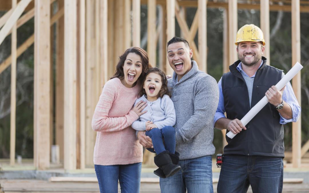 Hispanic family building a new home, with contractor